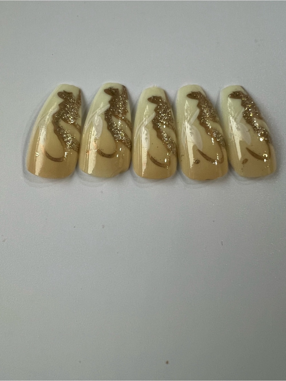 Neutral Swirl Press-On Nails with Gold Glitter Accent
